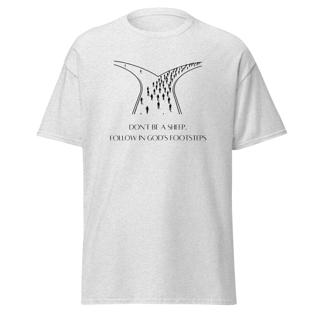 Ash grey T-shirt with a black illustration of people at a fork in the road above Don’t Be a Sheep, Follow in God’s Footsteps lettering, front view.