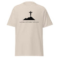 Natural beige T-shirt with a black crucifix on a hill above Anything Is Possible With God lettering, front view.