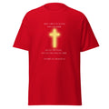 Red T-shirt with a glowing yellow cross and white Gospel of Thomas 77 quote about splitting wood and lifting a stone, front view.