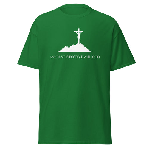 Green T-shirt with a white crucifix on a hill above Anything Is Possible With God lettering, front view.