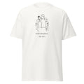 White T-shirt with a black line drawing of a family above Follow Jesus, We Do lettering, front view.